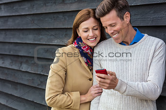 Happy Middle Aged Man Woman Couple Using Cell Mobile Phone
