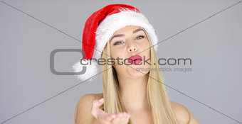 Pretty young woman posing in Santa Claus Hat