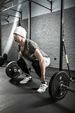 Man's crossfit workout with barbell