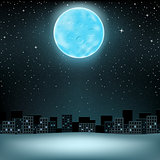 big blue moon over city