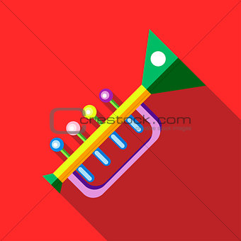 Children's toy musical trumpet on red background