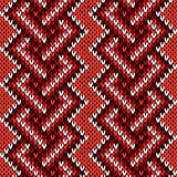 Seamless knitted interwoven pattern in warm hues