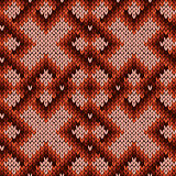 Knitting ornate seamless pattern in warm hues