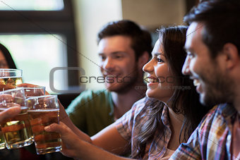 happy friends drinking beer at bar or pub
