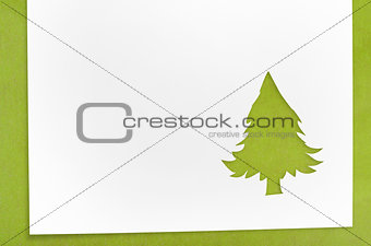 cut paper in fir-tree shape on table