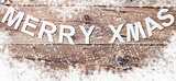 Merry Christmas sign on wooden background with copy space