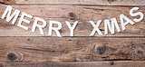 Merry Christmas sign on wooden background
