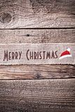 Christmas ribbon on wooden background 