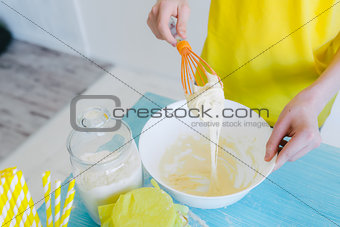 Kids in kitchen making dough