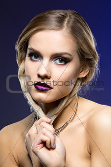 Beautiful girl with dark purple lips