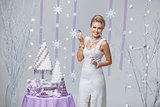 Beautiful winter bride with wedding cake