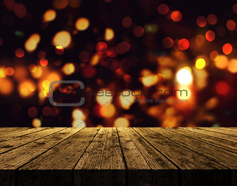 3D Christmas background with wooden table and bokeh lights