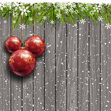 Christmas baubles on a wooden background