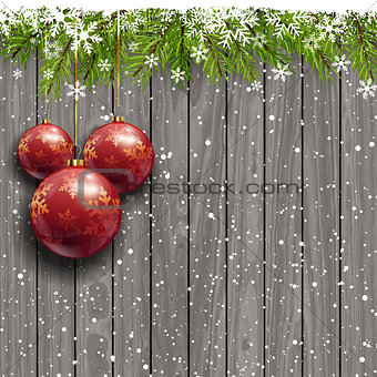 Christmas baubles on a wooden background