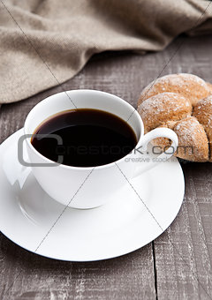 coffee cup with bread roll for breakfast morning