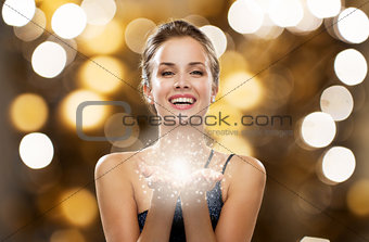 happy woman dress with fairy dust on palms