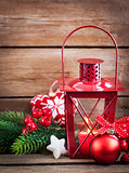 Christmas time red latern with candle light and holiday decorati