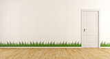 White room with closed door and grass