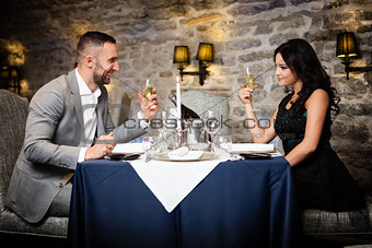 Couple celebrating in restaurant