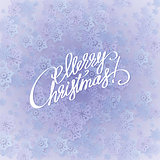Merry christmas handwritten text on background with snowflakes