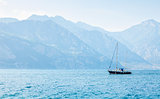 Sailer at water of lake bay