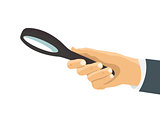 Human hand holding magnifying glass isolated