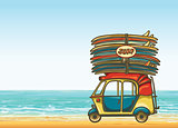 Auto rickshaw with surfboards and sea. Surfing.