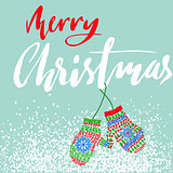 Merry Christmas. Handdrawn lettering for Christmas cards and posters. Mitten pair on a string.