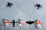 Halloween composition on gray concrete background