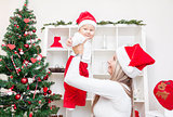 Mother with baby boy celebrating Christmas