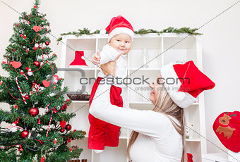 Mother with baby boy celebrating Christmas
