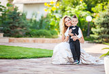 Happy bride and smiling little boy outdoors
