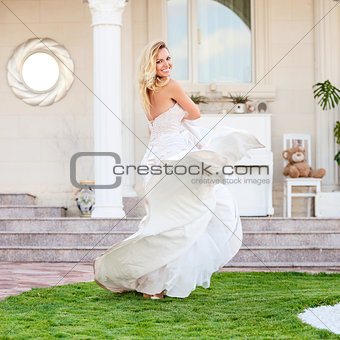 Gorgeous bride in wedding dress outdoors