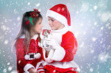 boy and girl as santa and elf 