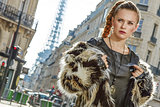 Portrait of modern woman in fur coat in Paris, France