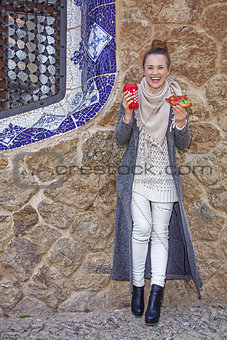 smiling tourist woman at Guell Park in Barcelona at Christmas