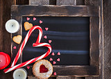 Chalk board and heart shaped candies and cookies