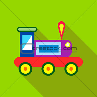 Children's toy train on a bright green background