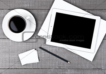 Graphic tablet with pencil paper sheet and coffee