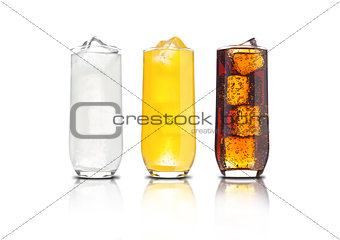 Glasses of orange soda, cola and lemonade iced