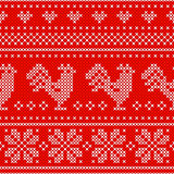 Red Holiday seamless pattern with cross stitch embroidered roosters.