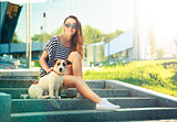 Smiling Trendy Hipster Girl with Dog in the City