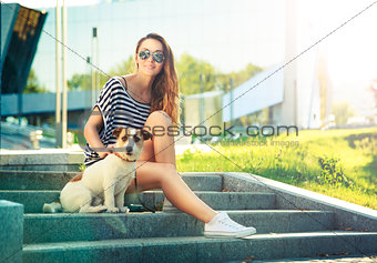 Smiling Trendy Hipster Girl with Dog in the City