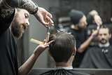 Cutting hair in barbershop