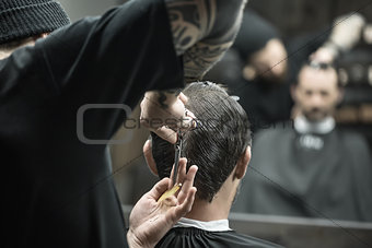 Doing haircut in barbershop