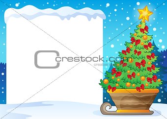 Snowy frame and Christmas tree on sledge
