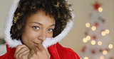 Sensual young woman in a Santa Claus outfit