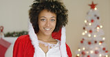 Gorgeous young woman in a festive Christmas cape