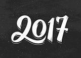 Happy New Year 2017 greetings on black chalkboard
