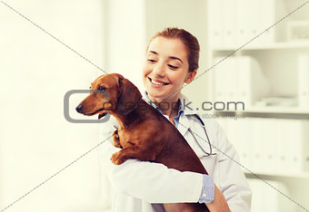 happy doctor with dog at vet clinic
